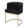 Fauteuil en velours noir et métal coloris laiton